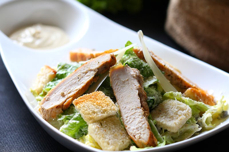 Fresh Caesar salad with croutons and Parmesan shavings