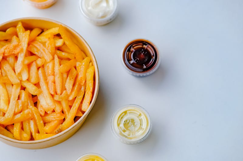 Loaded crispy fries with toppings and dipping sauces