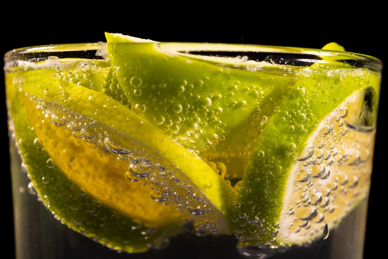 Sparkling Italian craft soda with fresh fruit garnish