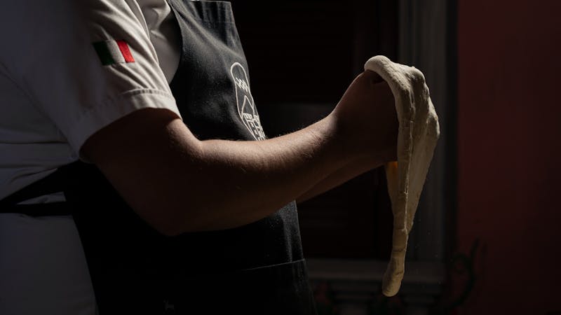 Pizza factory kitchen team at work
